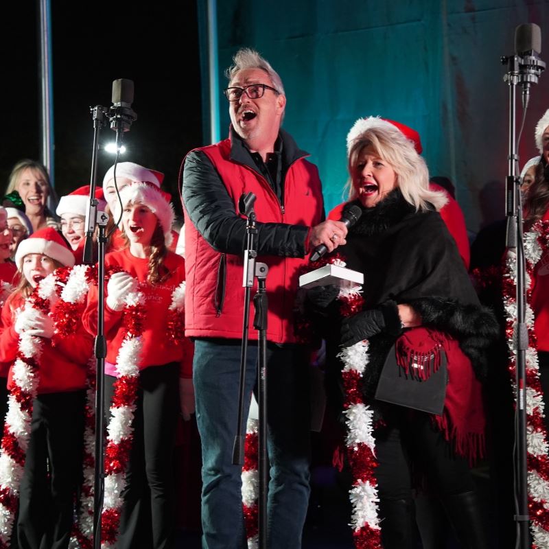Mayor Jody McLeod and Ann Austin Count down tree lighting in festive red and white apparel