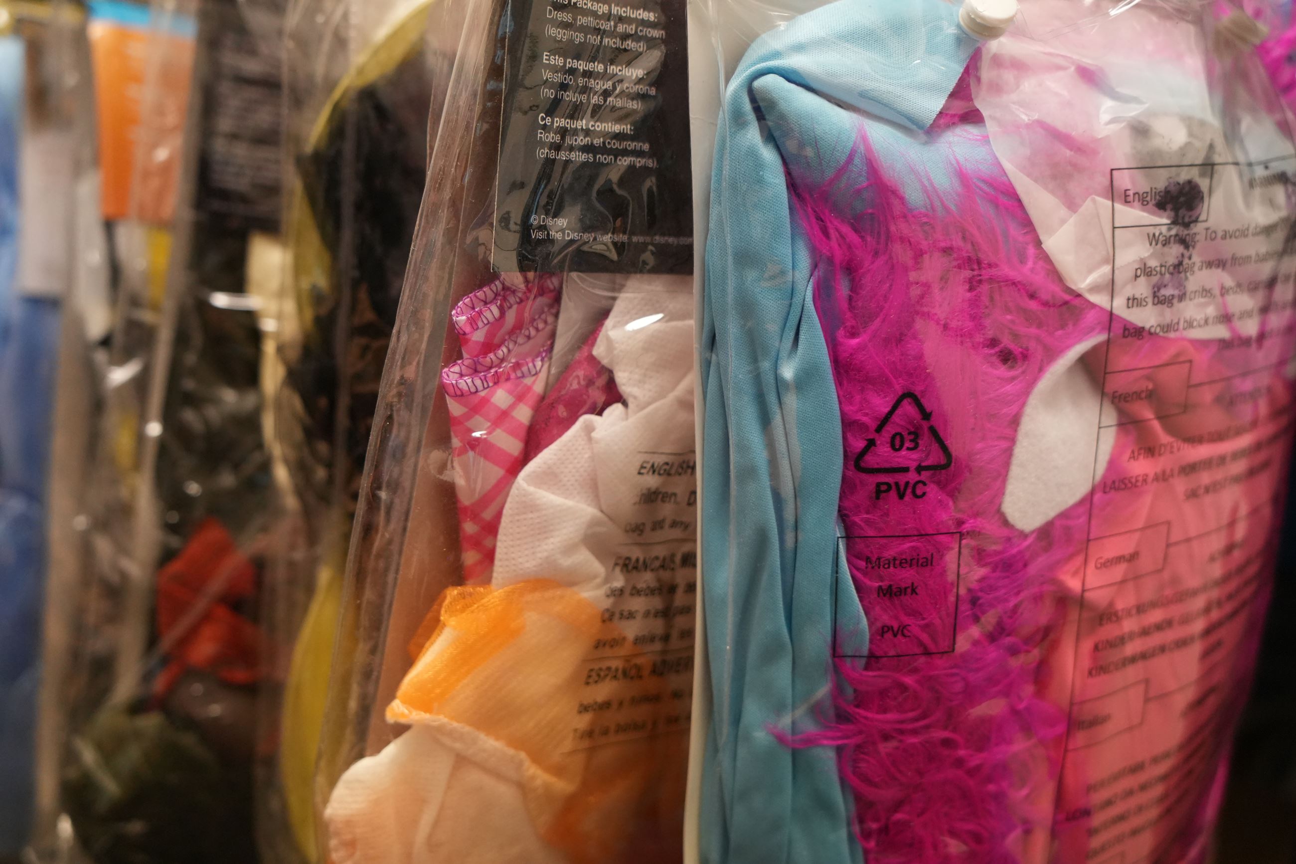 Halloween Costume Swap Donations Are Hanging in a Row 