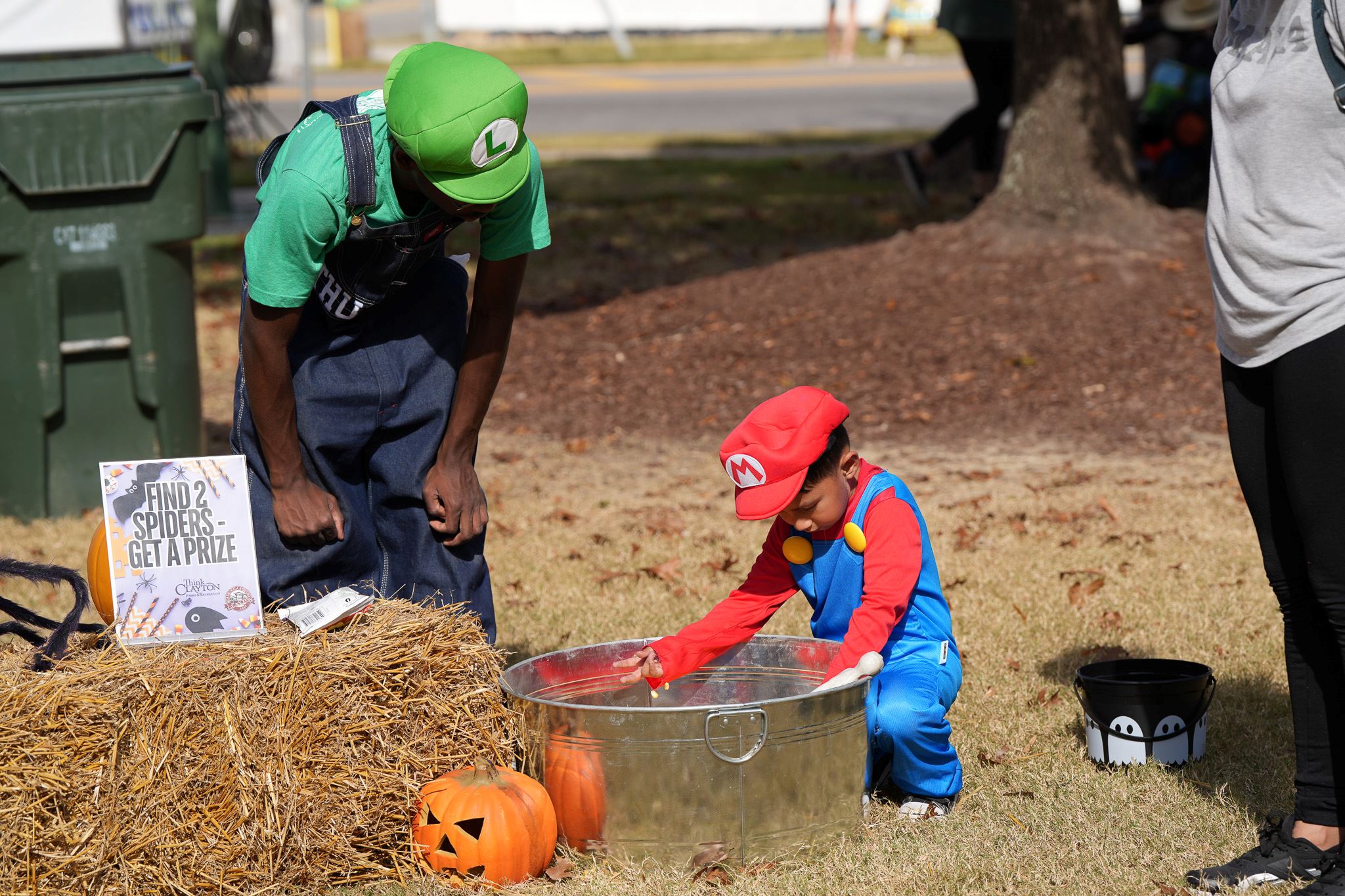 Kids in costumes collect candy during Trick-or-Treat Main Street 