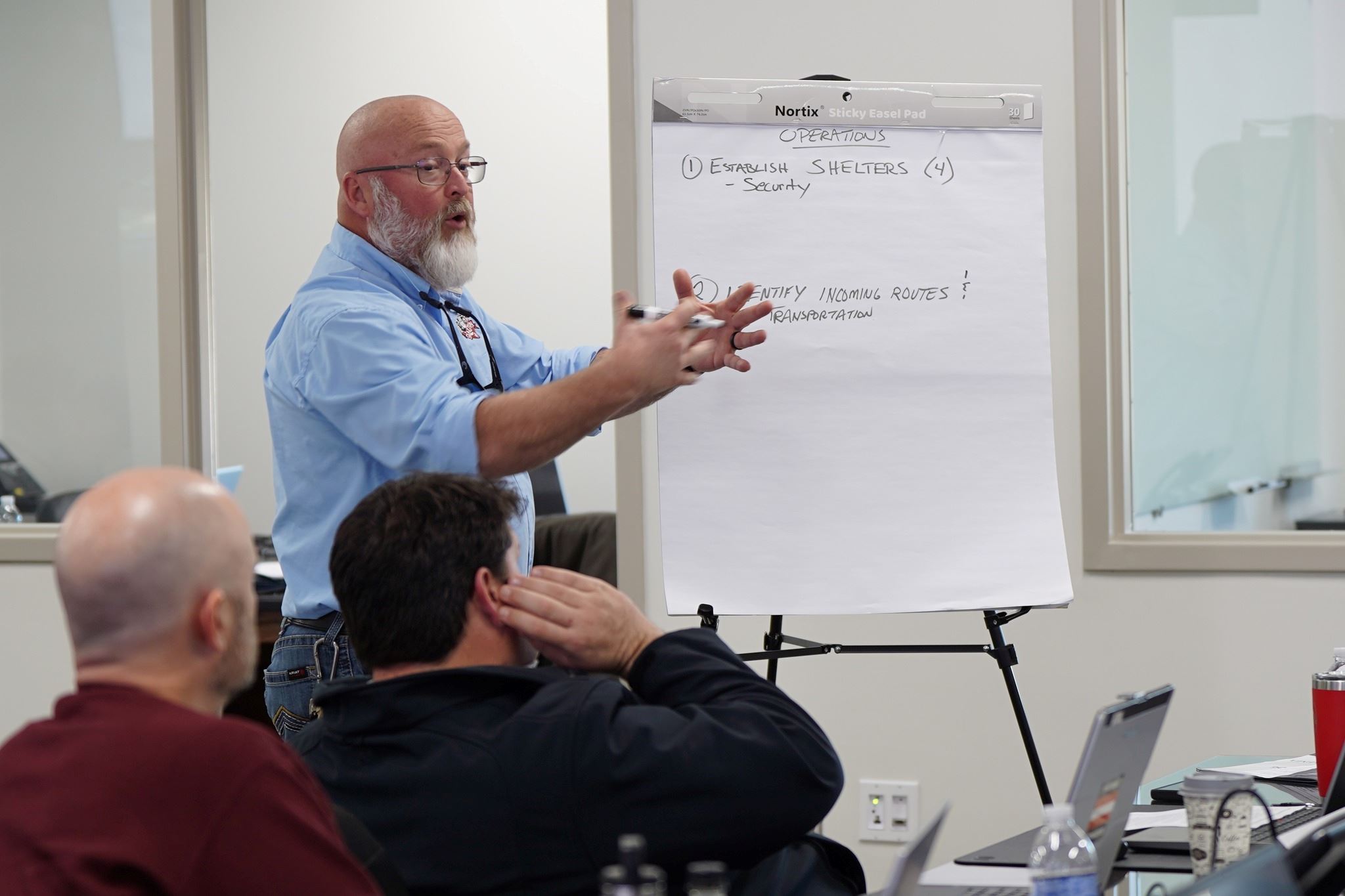 Town staff at white board to discuss emergency operations