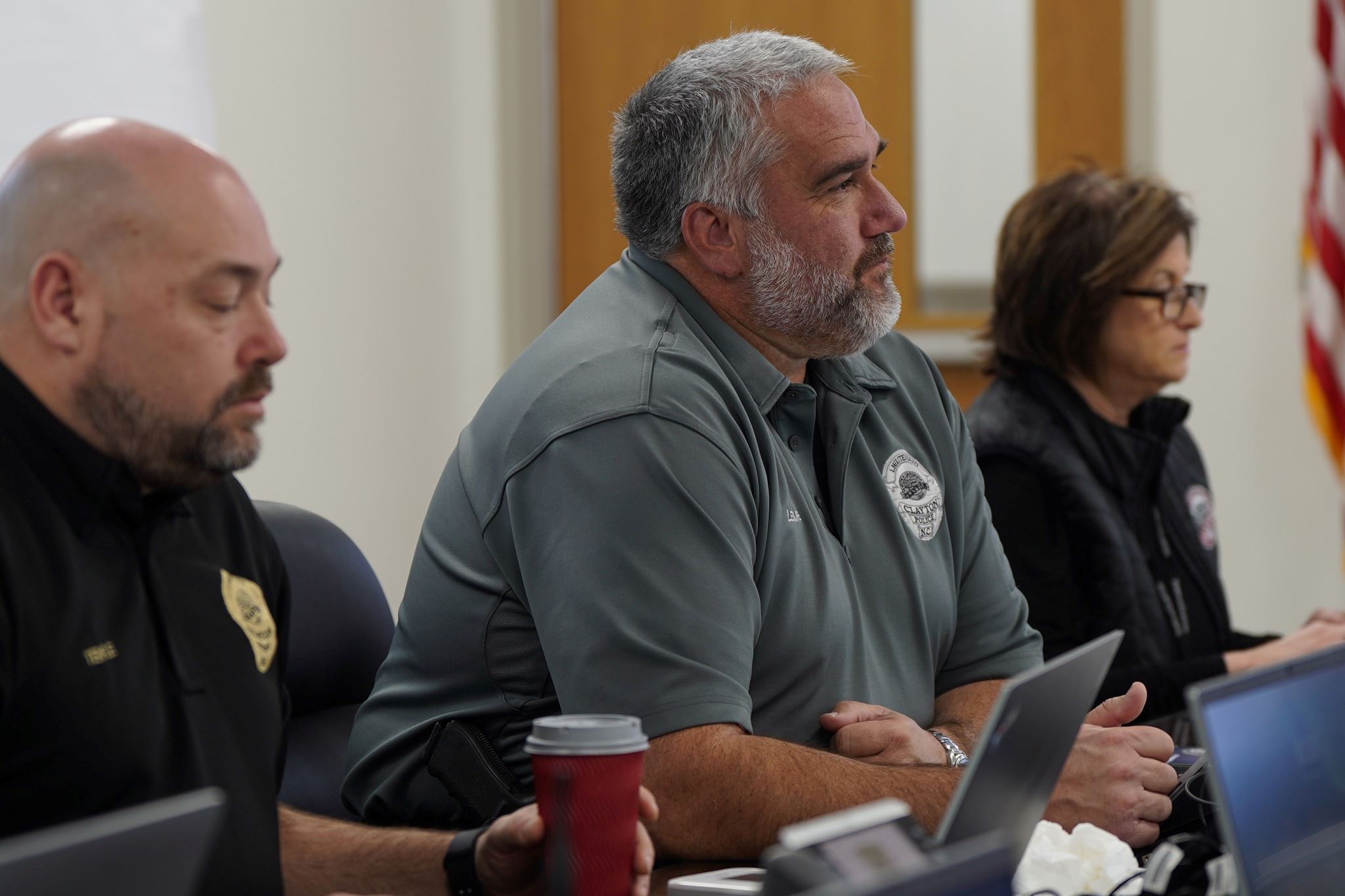 Town staff members listen for instructions
