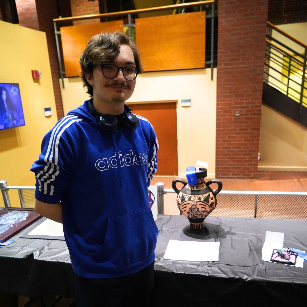 Andrew Reichart with his award-winning artwork