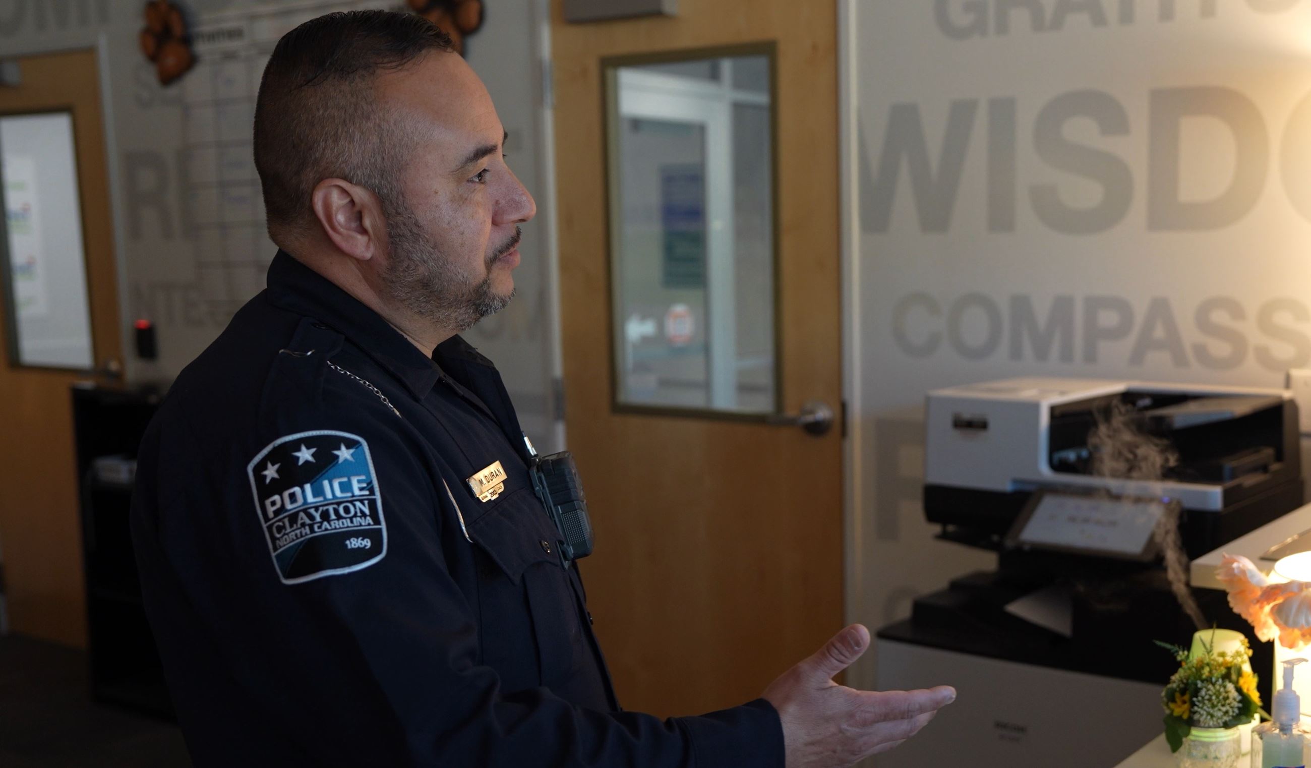 Officer Miguel Duran in the main office at Johnston Charter School 