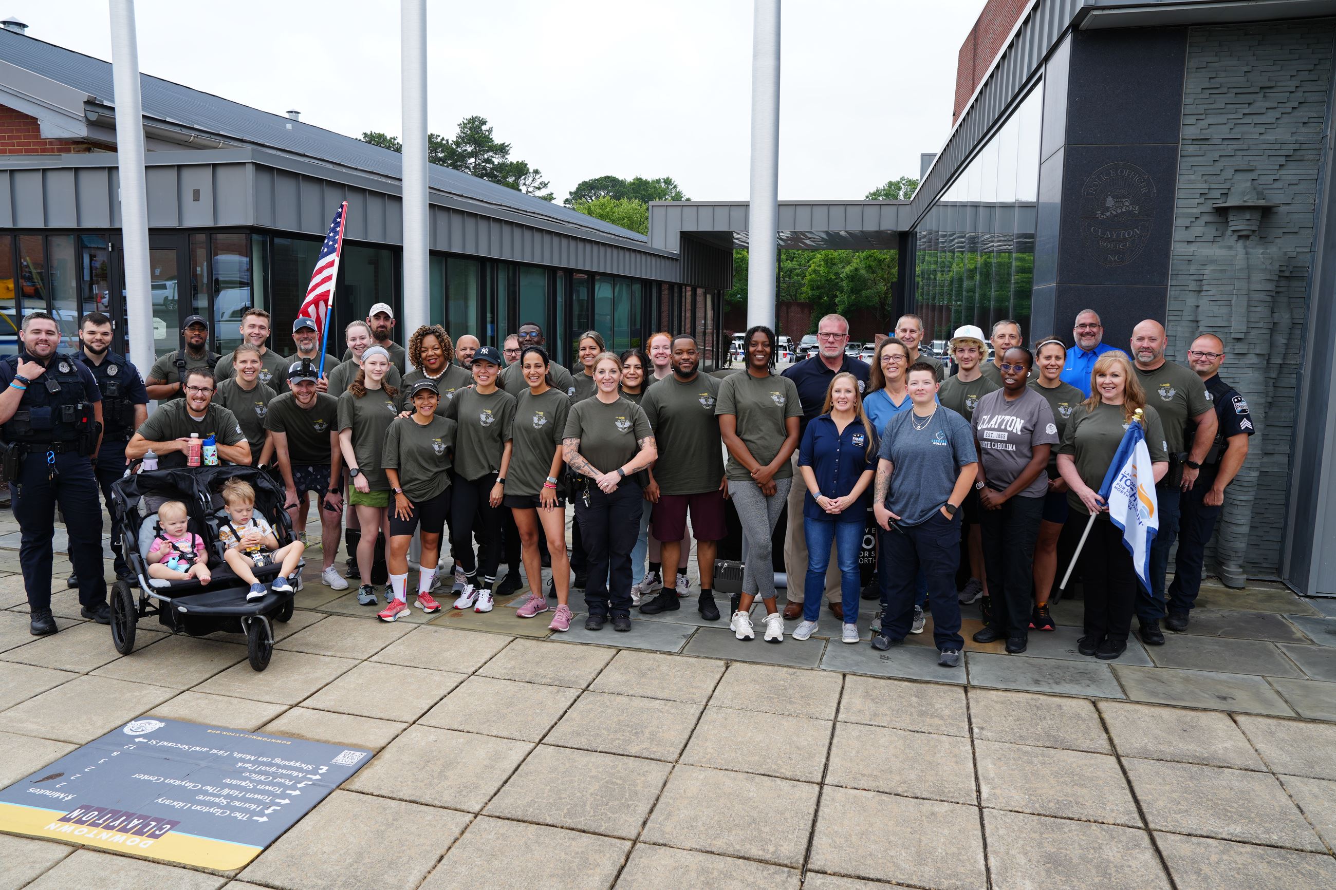 Torch Run Group poses for photo in front of Clayton Police Department