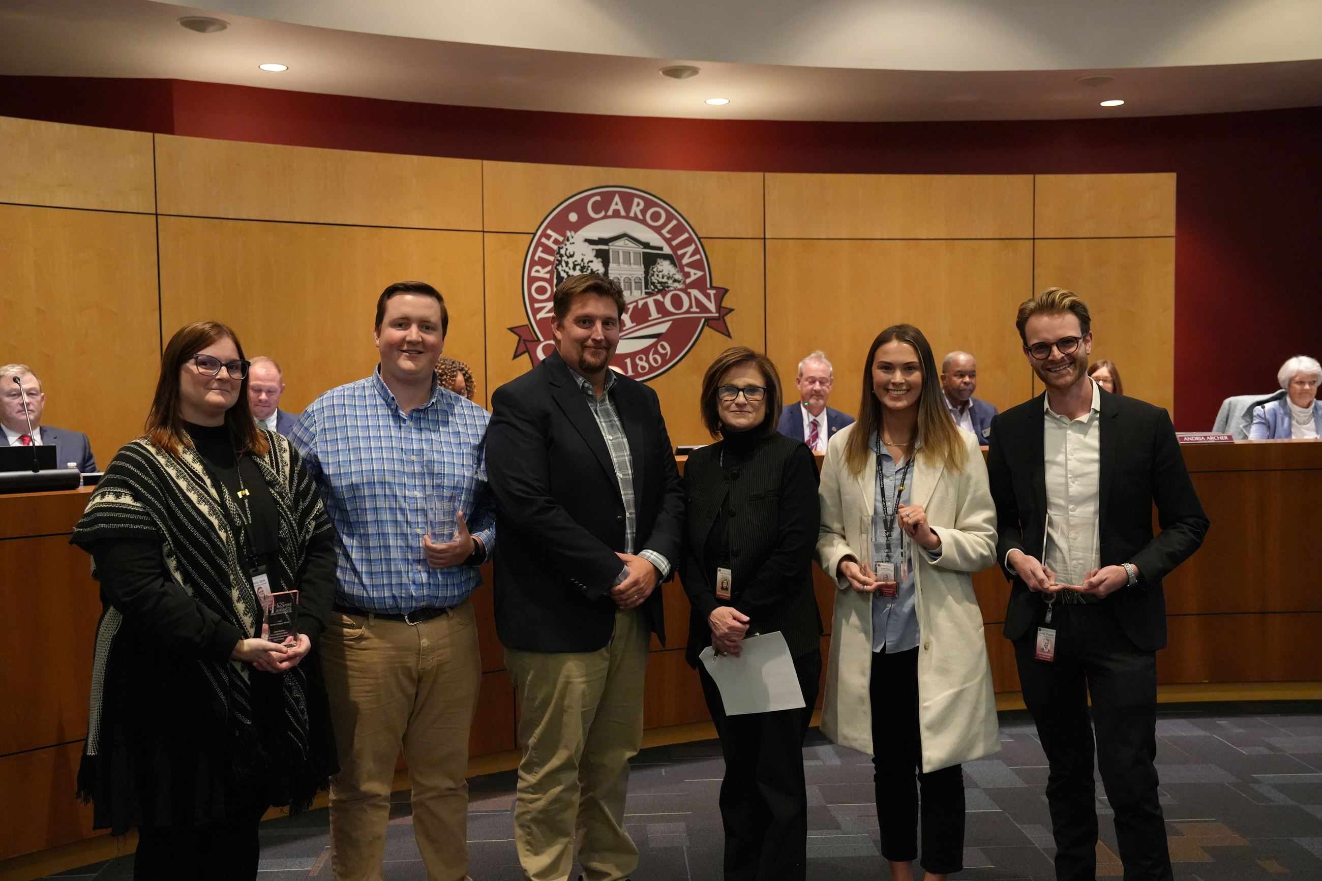 Clayton communications team stands in front of council with chief of staff & initiatives