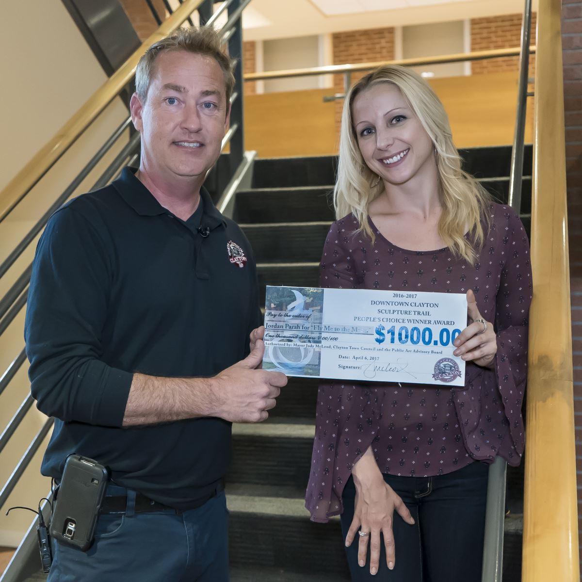 Jordan Parah receives the Peoples Choice prize from Mayor Jody McLeod